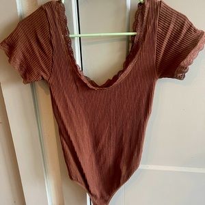 Francesca’s brown bodysuit with lace detail.
